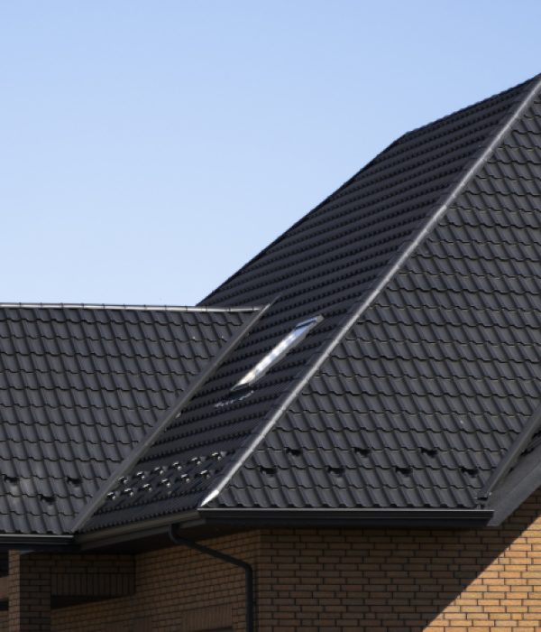 Brown Corrugated Metal Profile Roof Installed On A Modern House